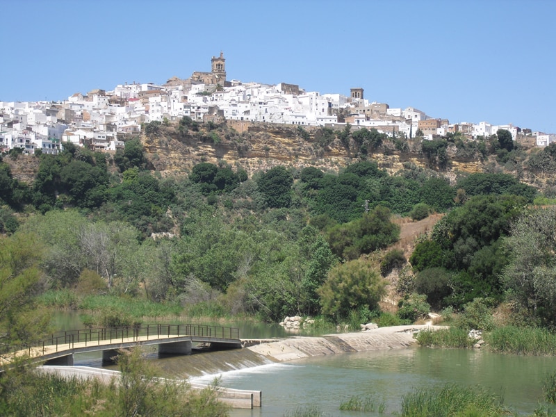 A view of the town of Arcos de la Frontera on the hill from the river